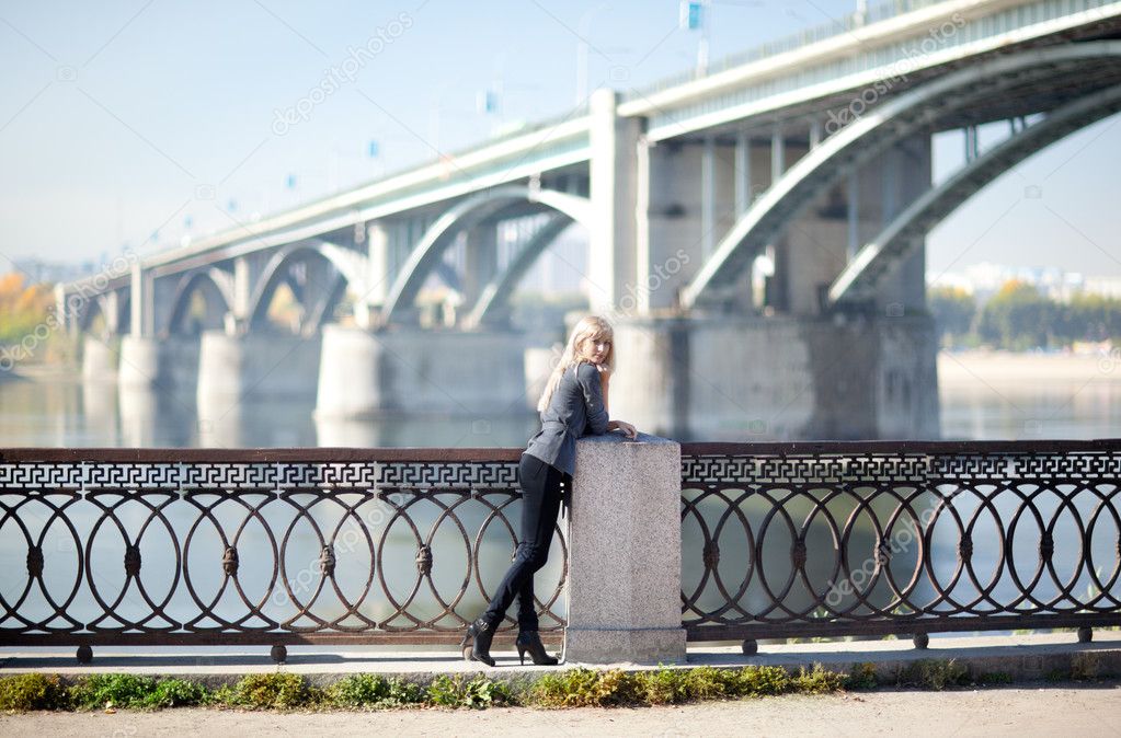 Beautiful woman with bridge on the background Stock Photo by ©zastavkin  8801226