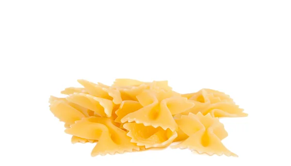 Heap farfalle pasta geïsoleerd op witte achtergrond — Stockfoto