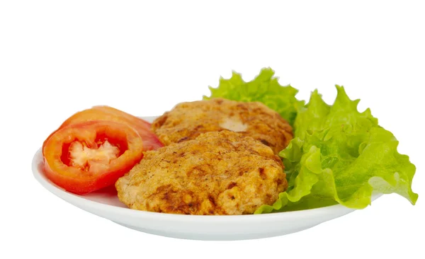 Patties on a plate with lettuce leaves — Stock Photo, Image