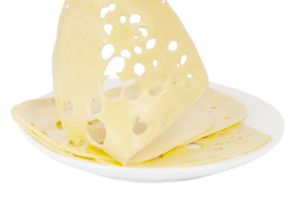Шматочок сиру на тарілці ізольовані — стокове фото