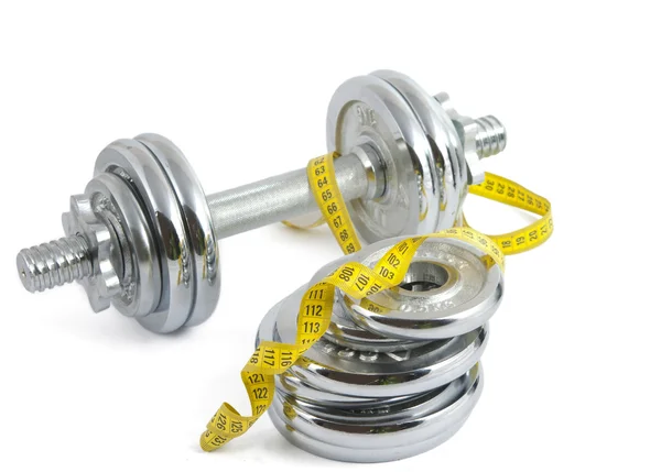 Dumbbell with a measuring tape — Stock Photo, Image