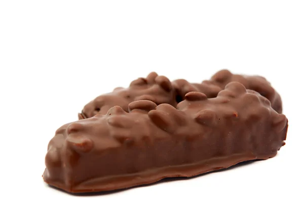 Chocolate con frutos secos aislados — Foto de Stock