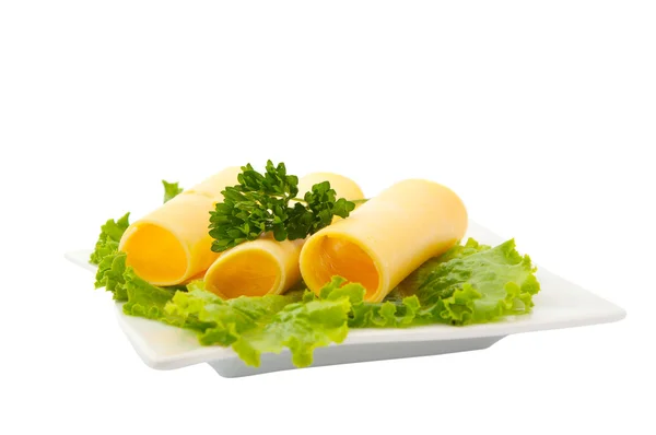 Slices of cheese with lettuce — Stock Photo, Image