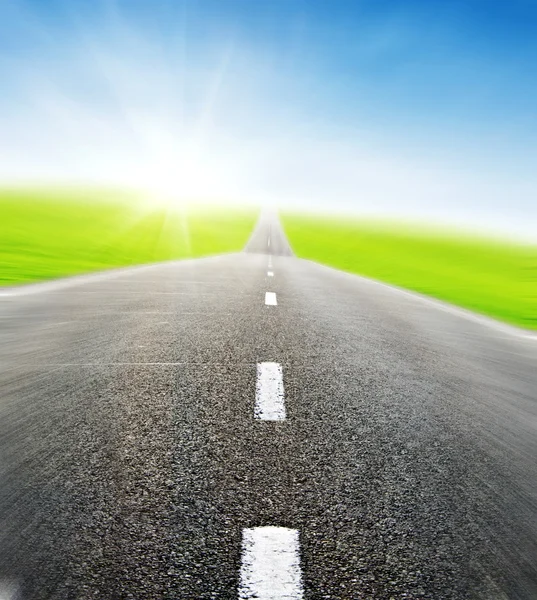 Road over blue sky in motion — Stock Photo, Image