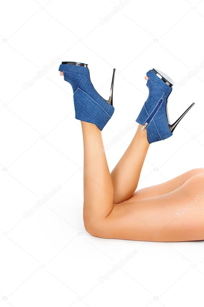 Female legs in high heels isolated