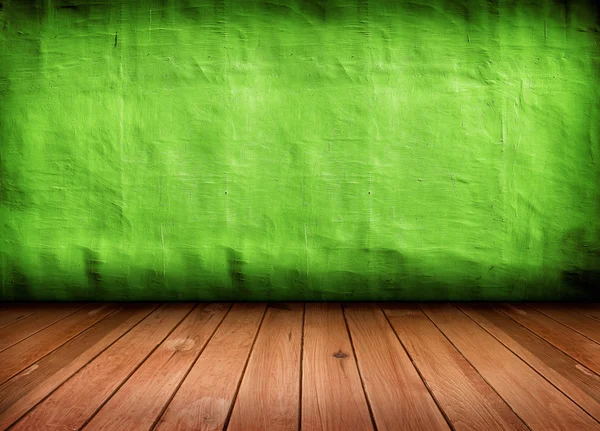 Σκοτεινό vintage πράσινο δωμάτιο με ξύλινο πάτωμα και καλλιτεχνικές σκιές ένα — Φωτογραφία Αρχείου