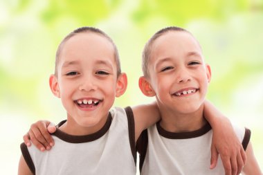 Two smiling happy boys twins clipart