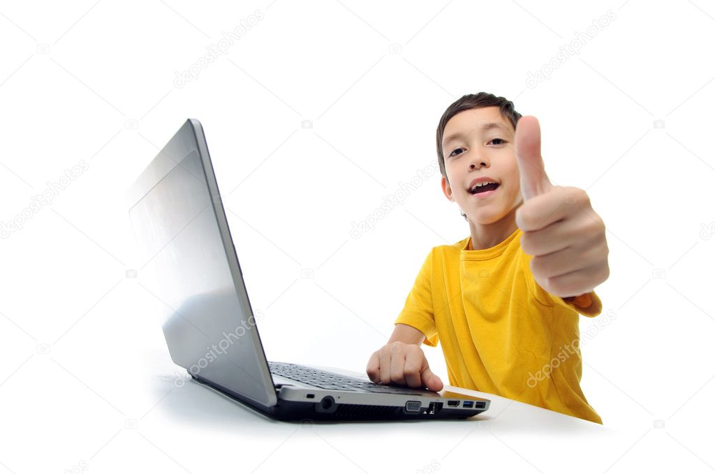 Young boy in yellow t-shirt with laptop showing thumbs up at cam