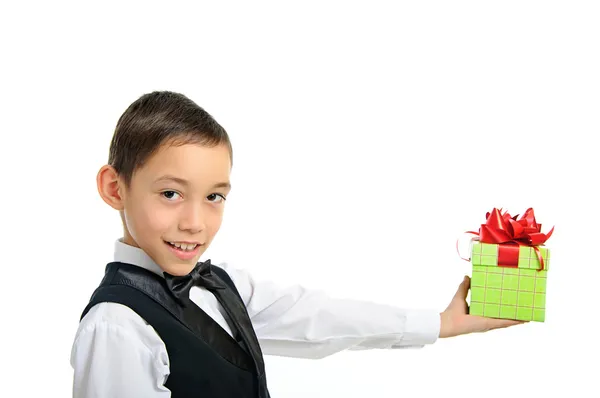 Boy holding gift box with bow isolated on white — Stock Photo, Image