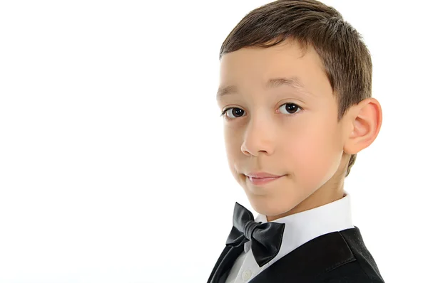 Niño de escuela en traje negro con aislado sobre fondo blanco — Foto de Stock