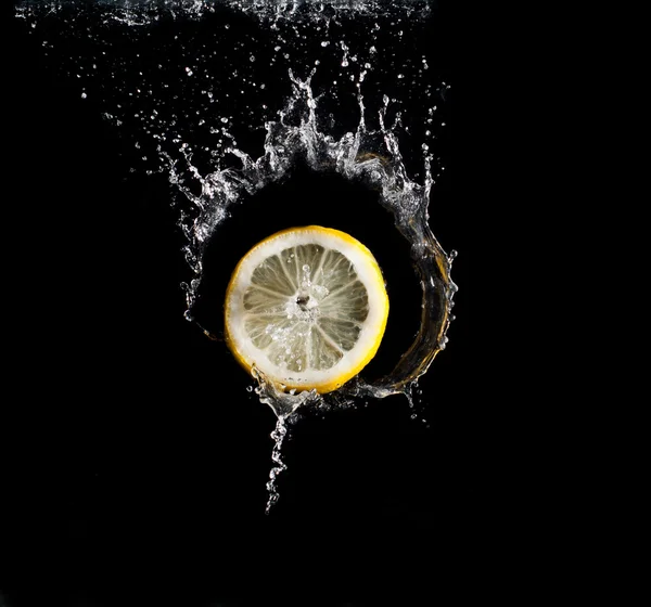 stock image Lemon in water splash