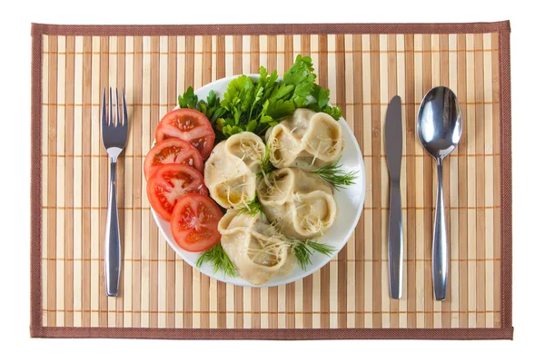 stock image Tasty hinkali with tomato and salad