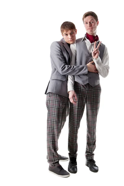Bashful students in checkered pants — Stock Photo, Image