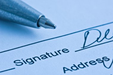 Signature. Close-up of a pen. clipart