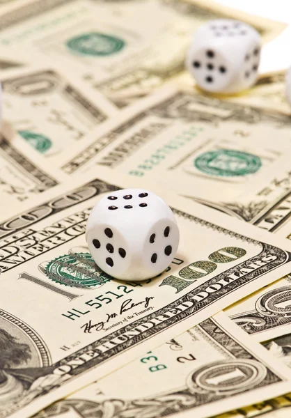 Pair of dice on money — Stock Photo, Image