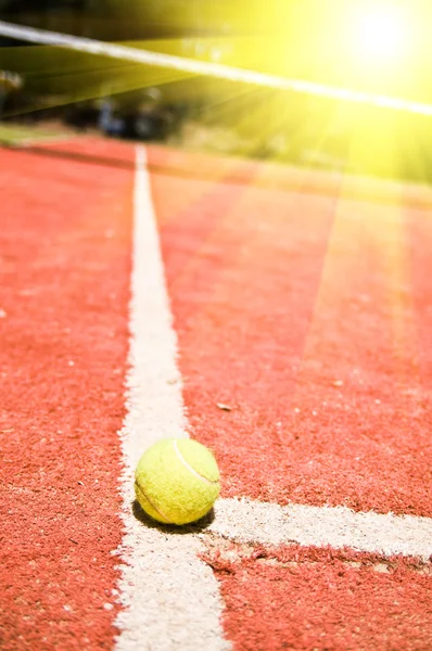 Tennis ball on the court — Stock Photo, Image