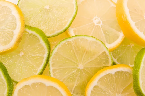 Lemon and lime slices — Stock Photo, Image