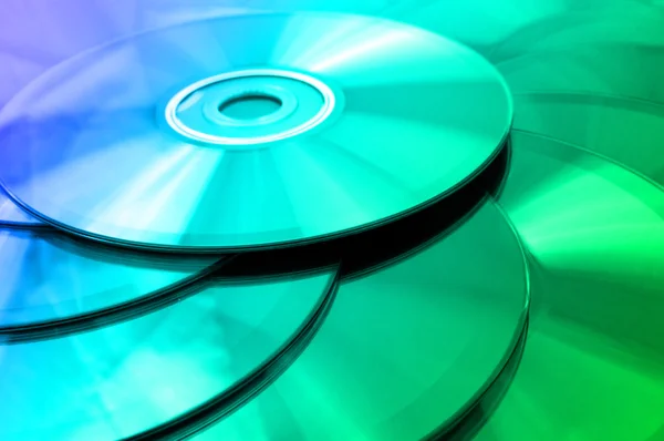 Contexto de alguns discos compactos coloridos — Fotografia de Stock