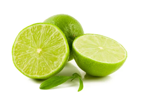 Green limes on white background — Stock Photo, Image
