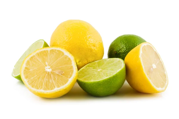 Limones y limas sobre blanco Fotos de stock