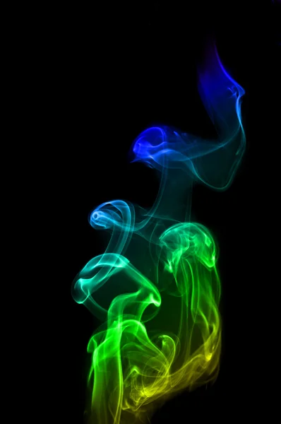 Färgglada rainbow rök på svart — Stockfoto