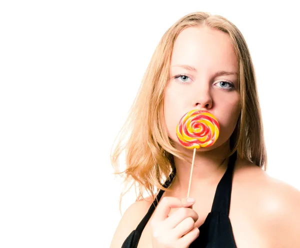 Woman and sweet sugar candy. Isolated on white. — Stock Photo, Image