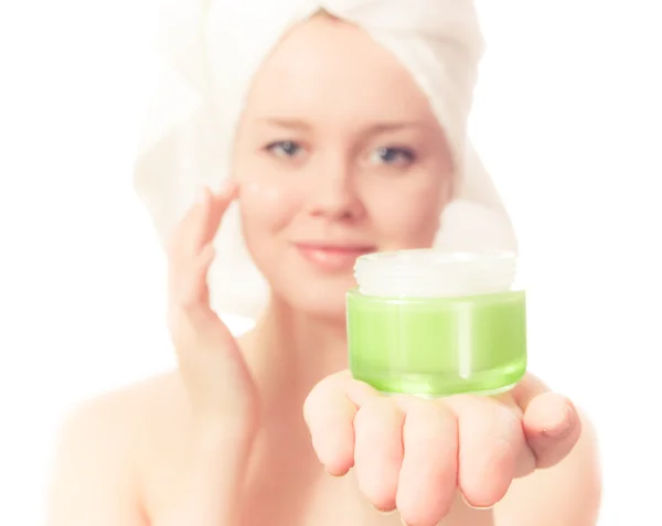 Young girl with towel on her head and cream. — Stock Photo, Image