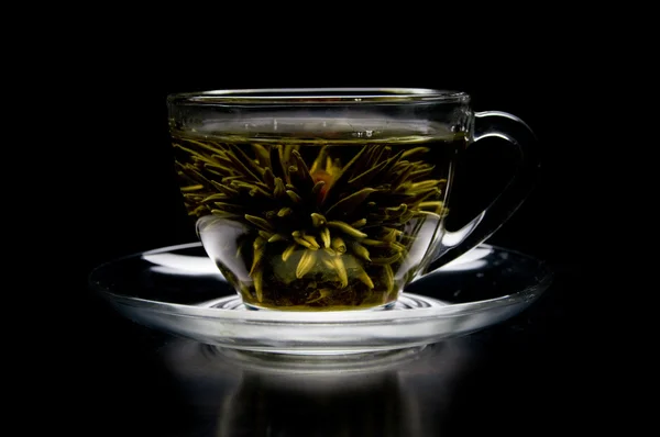 Cup with blooming flower green tea — Stock Photo, Image
