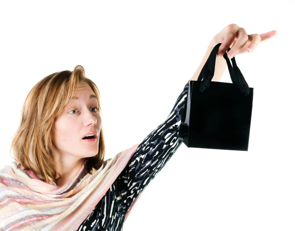 Happy young woman with shopping bag — Stock Photo, Image