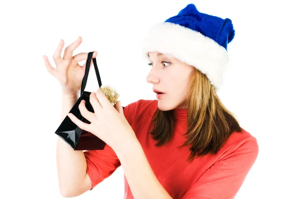 Happy woman looking inside black shopping gift bag looking surpr — Stock Photo, Image