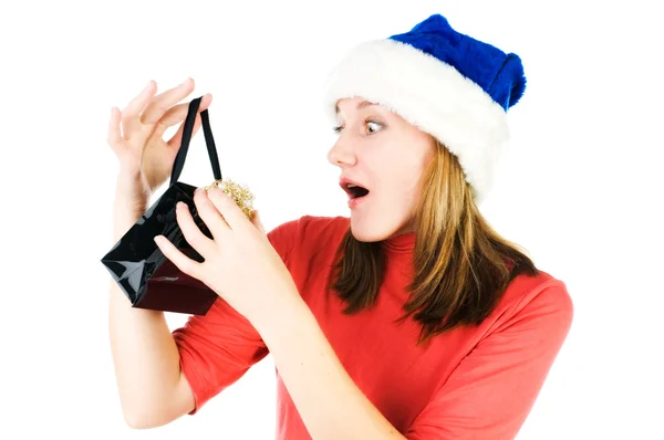 Woman looking inside black shopping gift bag looking surprised. — Stock Photo, Image