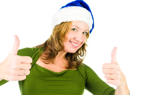 Happy woman in christmas hat with thumbs up — Stock Photo, Image