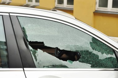 Broken passenger window, car theft clipart