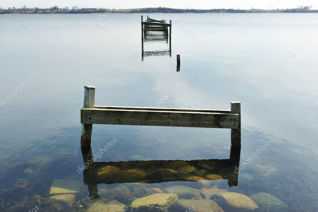 Old wooden pier on the lake