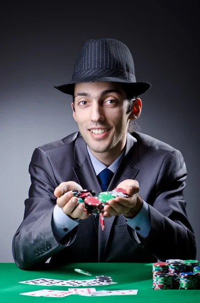 Casino player playing with chips — Stock Photo, Image