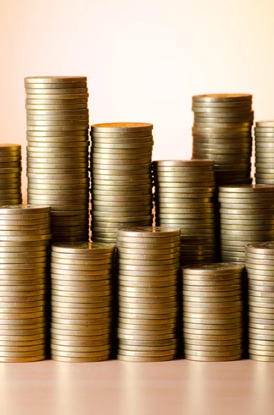 Golden coins in high stacks — Stock Photo, Image