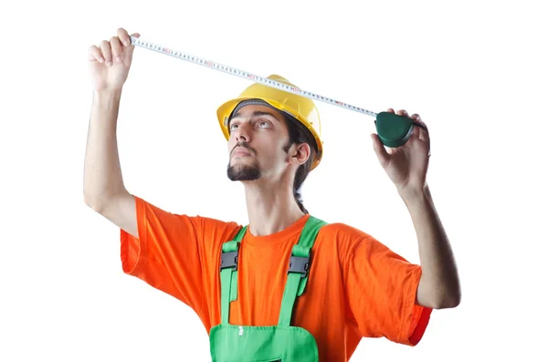 Worker with measuring tape on white — Stock Photo, Image