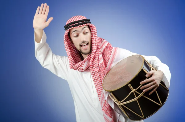 Arab playing drum in studio shooting Stock Picture