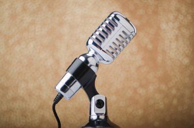 Old vintage microphone on background clipart