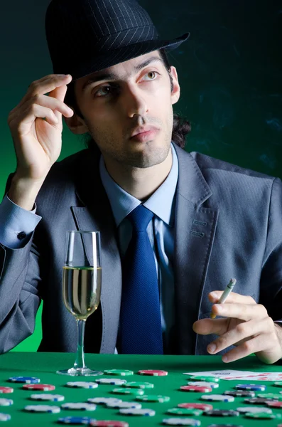 Player in casino and chips — Stock Photo, Image