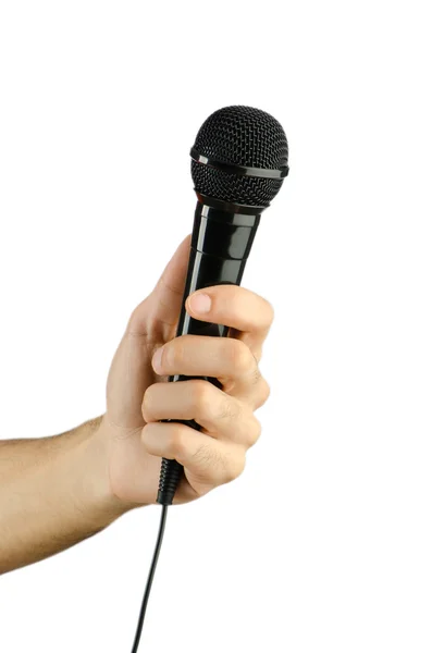 Hand holding microphone on white — Stock Photo, Image
