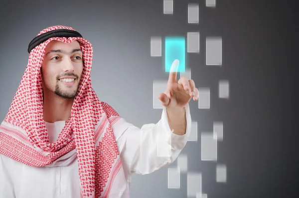 Young arab pressing virtual buttons — Stock Photo, Image