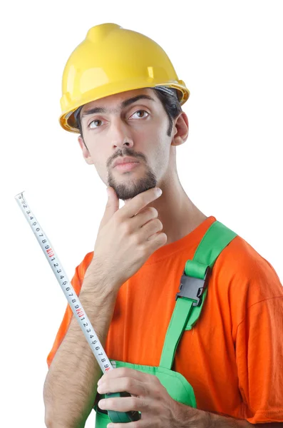 Worker with measuring tape on white — Stock Photo, Image