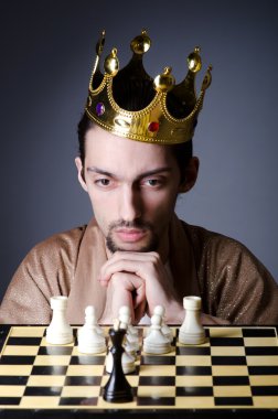 Chess player playing his game clipart