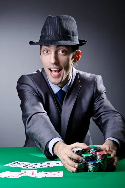 Casino player playing with chips — Stock Photo, Image