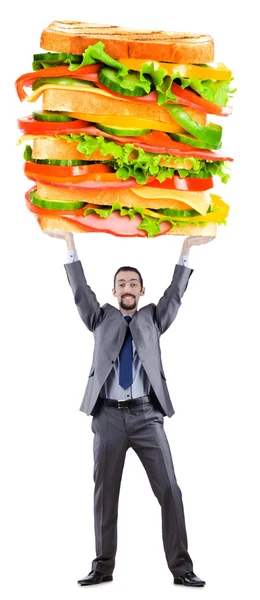 Man och jätte smörgås på vit — Stockfoto