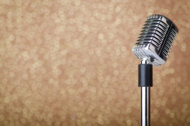 Old vintage microphone on background clipart