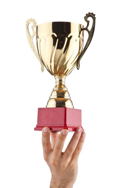 Hands with winners cup on white — Stock Photo, Image