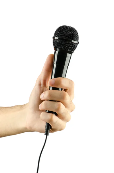 Рука держит микрофон на белом — стоковое фото