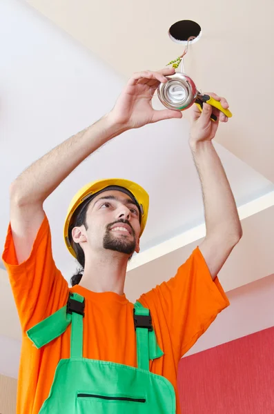 Electrician working on cabling lighting — Stock Photo, Image
